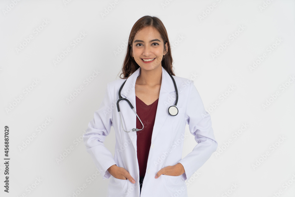 close up of attractive female doctor with good mood smiling teeth with hands in pocket close up of attractive female doctor with good mood smiling teeth with hands in pocket