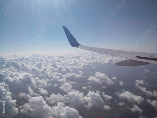 Fluffy clouds in the heaven, view from the aircraft 