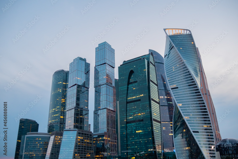 Modern tall office buildings, luxury apartments, glass skyscrapers at city downtown against evening sky. Moscow International Business Center. Architecture, corporate, financial and cityscape concept