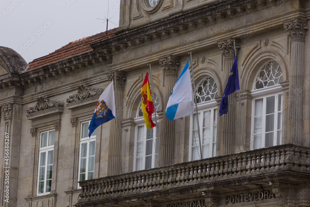 Flags in motion on the balcony of an official organization