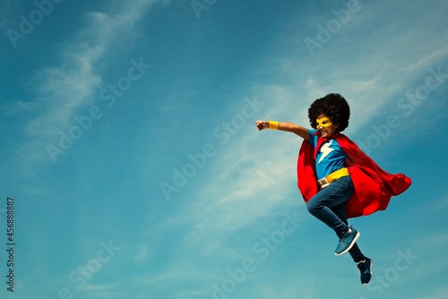 Strong superhero girl with superpowers photo