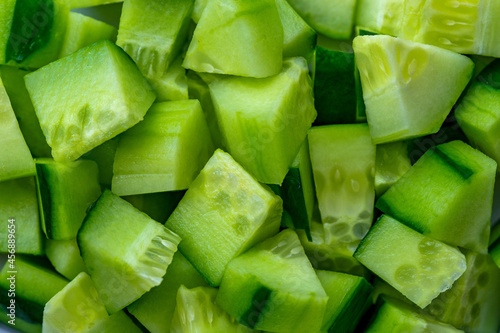 Dice of Cucumber, diced Cucumber background. Food background of vegetable texture. Ingredient for salad. close-up