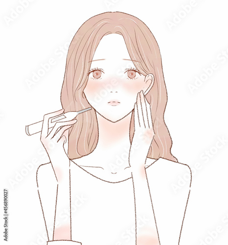 体温計で熱を測る女性
