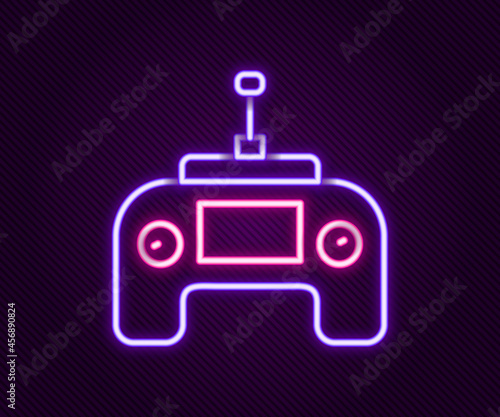 Glowing neon line Drone radio remote control transmitter icon isolated on black background. Colorful outline concept. Vector