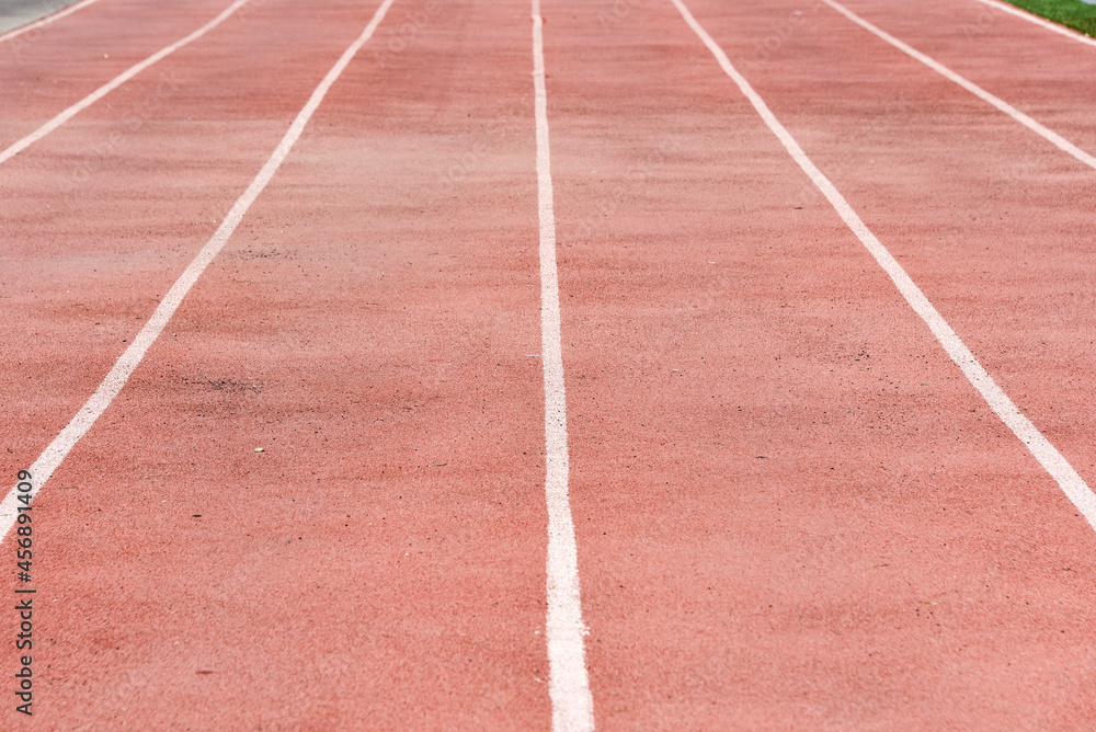 Red running tracks close-up at the stadium. Running love concept Red running tracks close-up at the stadium. Running love concept