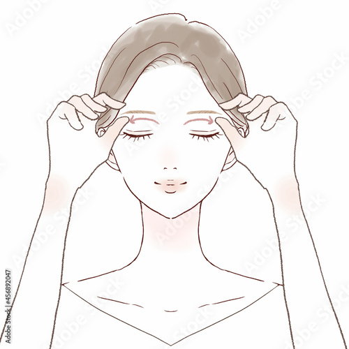 目の上をマッサージする女性