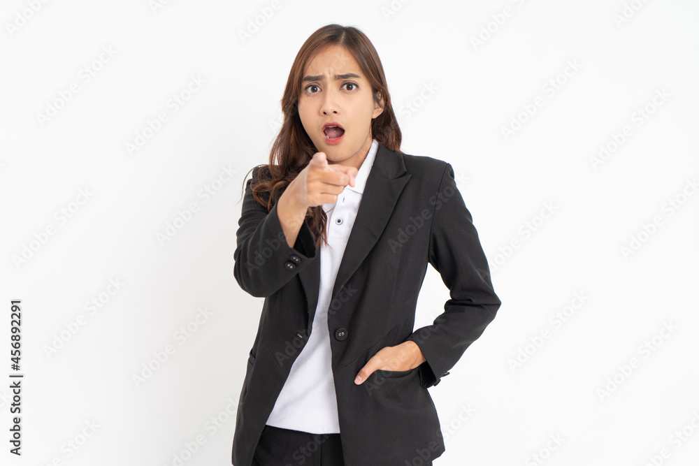 young businessman wearing suit pointing at camera with surprised expression young businessman wearing suit pointing at camera with surprised expression