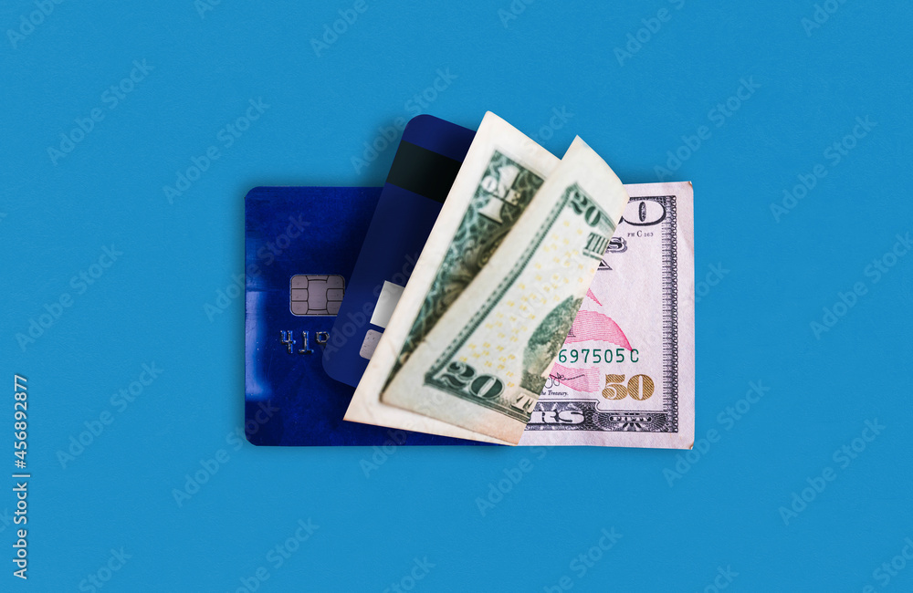 credit card and US dollars paper money
credit card and US dollars paper money