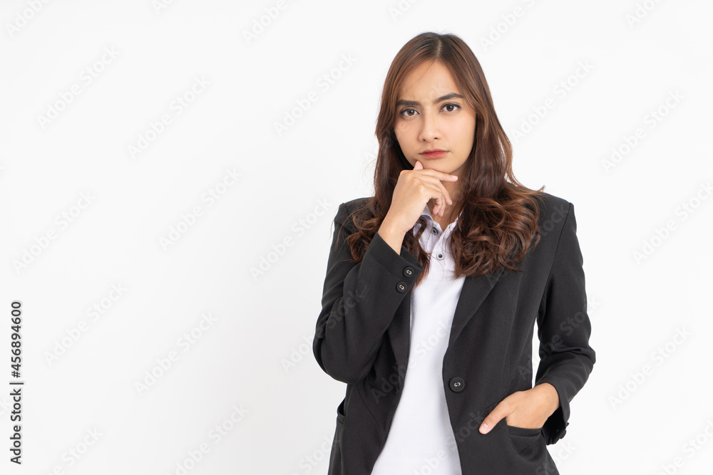 young businesswoman wearing black suit thinking seriously with hand holding chin with copyspace young businesswoman wearing black suit thinking seriously with hand holding chin with copyspace