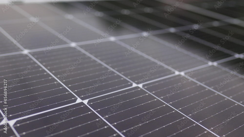 Photovoltaic solar panel extreme close up. Close-up of modern photovoltaic solar battery panels. Rows of sustainable energy solar panels installed on terrace. Solar panels on roof top. Panels at home. Photovoltaic solar panel extreme close up. Close-up of modern photovoltaic solar battery panels. Rows of sustainable energy solar panels installed on terrace. Solar panels on roof top. Panels at home.
