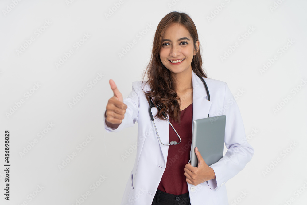 attractive female doctor smiling teeth in uniform with thumbs up holding a pad attractive female doctor smiling teeth in uniform with thumbs up holding a pad
