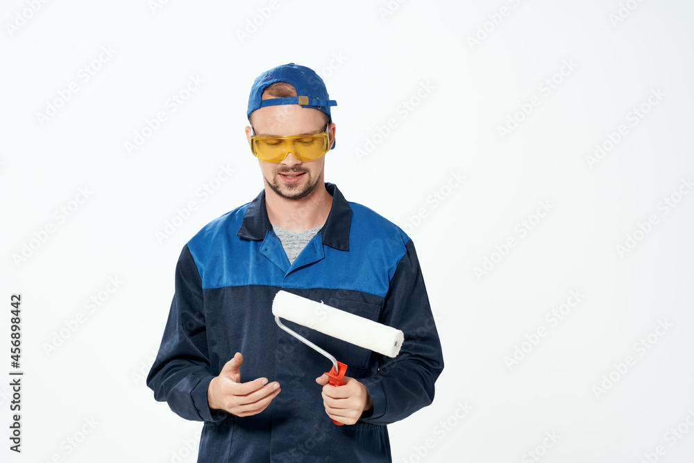 man in work uniform wall painting repair service man in work uniform wall painting repair service