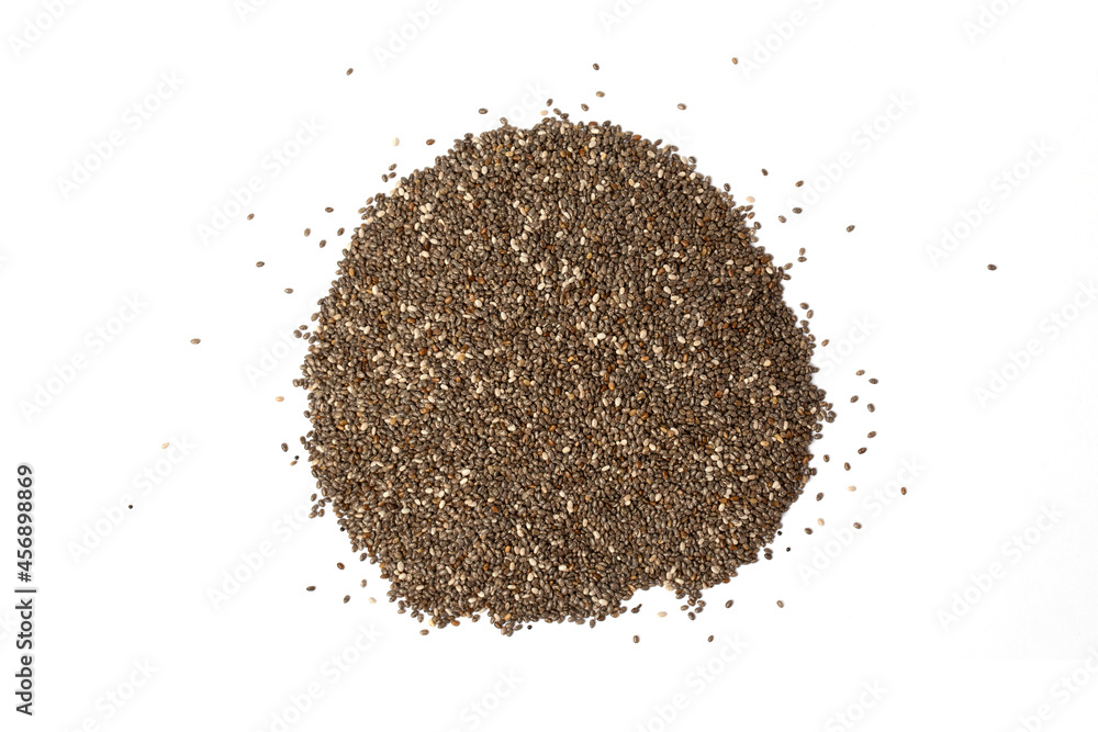 Chia seeds scattered in a pile on a white background. Chia seeds scattered in a pile on a white background.