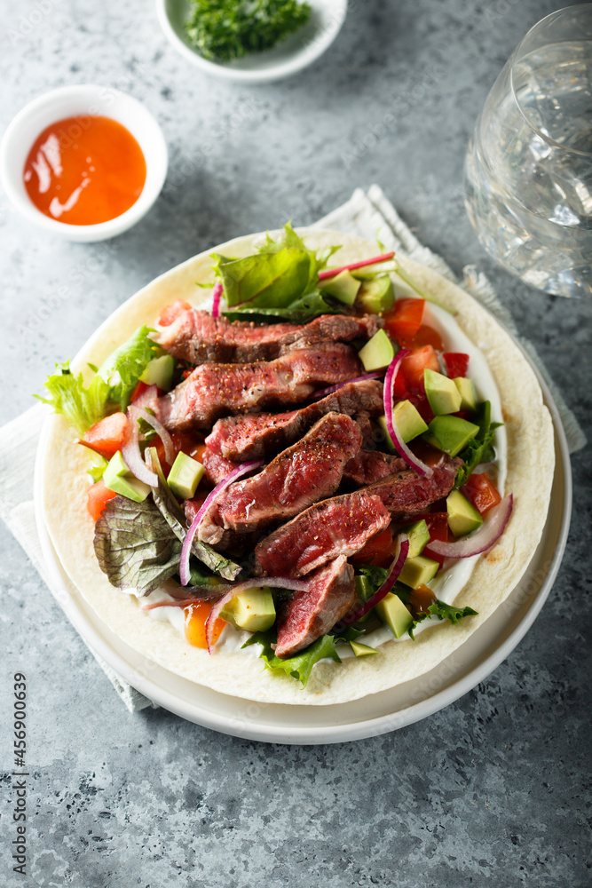 Beef steak fajitas with avocado and onion Beef steak fajitas with avocado and onion
