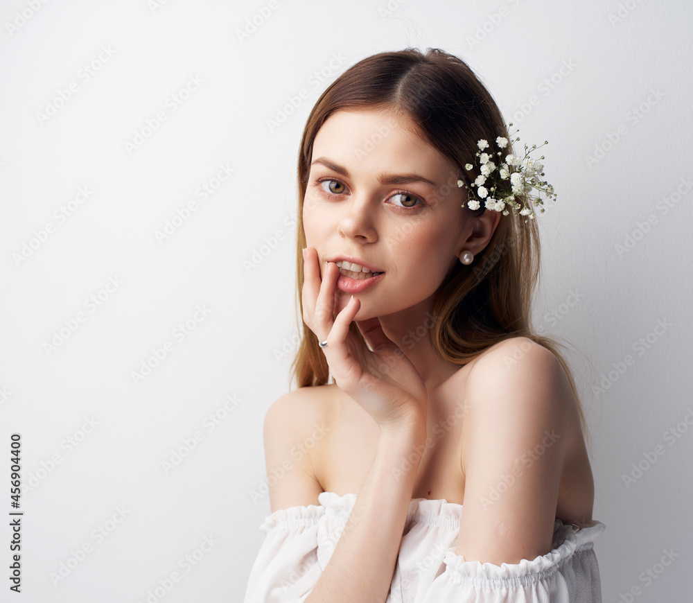 pretty woman in a white dress light background