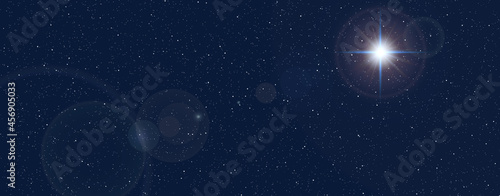 Christmas star and starry sky. Nativity of Jesus Christ. Background of the beautiful dark blue starry sky and bright star