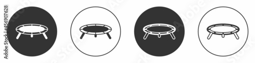 Black Jumping trampoline icon isolated on white background. Circle button. Vector