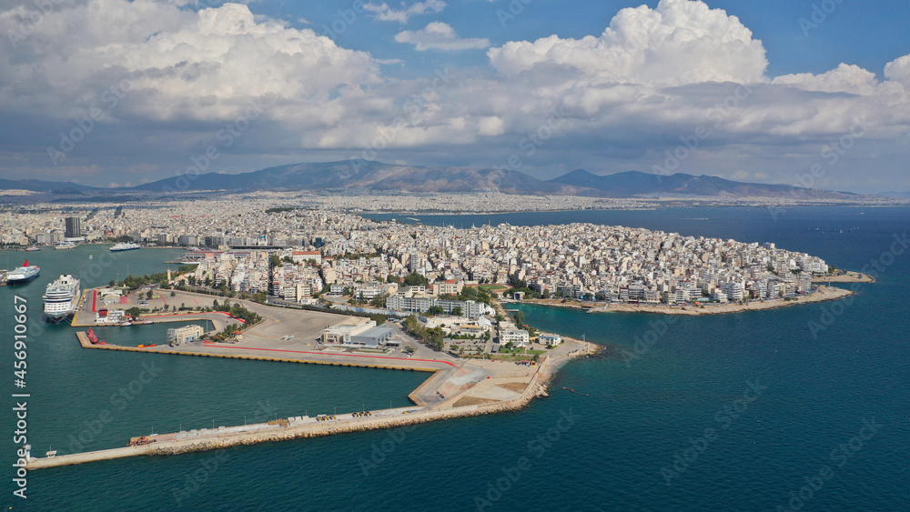 Aerial drone photo of famous busy port of Piraeus where passenger ferries travel to popular Aegean island destinations on a cloudy beautiful day, Attica, Greece