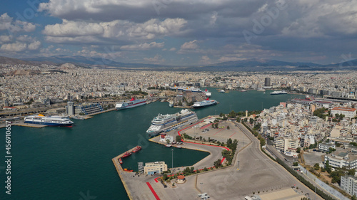 Aerial drone photo of famous busy port of Piraeus where passenger ferries travel to popular Aegean island destinations on a cloudy beautiful day, Attica, Greece