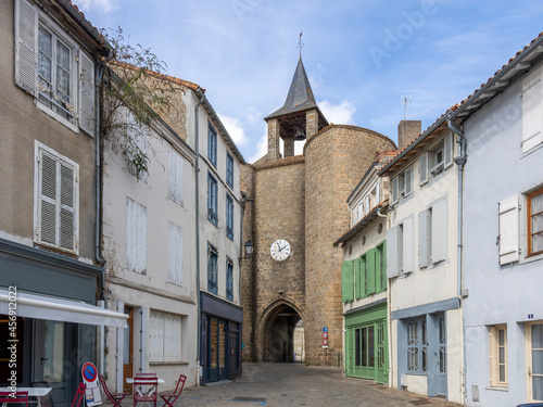 The ramparts of Parthenay. The Porte de la Citadelle (or Clock Tower) of the 13th century, it was an access door in the ramparts around the Citadel district of Parthenay.. France. photo