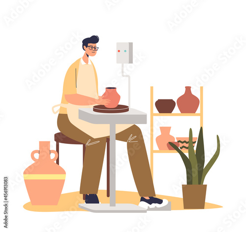 Young ceramist making pot of raw clay on pottery wheel. Male ceramic artist shaping earthenware