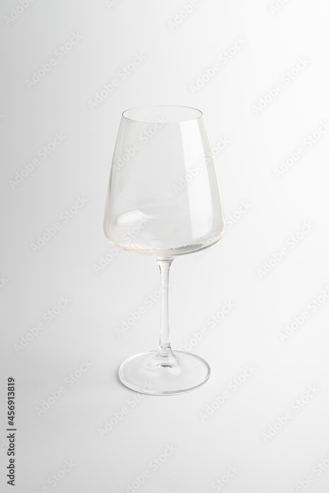 Empty transparent wine glass on the white background Empty transparent wine glass on the white background