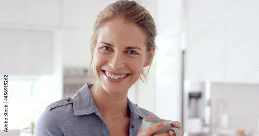Woman drinking coffee and smiling at camera in close up slow motion portrait Woman drinking coffee and smiling at camera in close up slow motion portrait