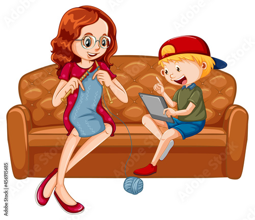 Boy sitting on couch learning from tablet with his mother