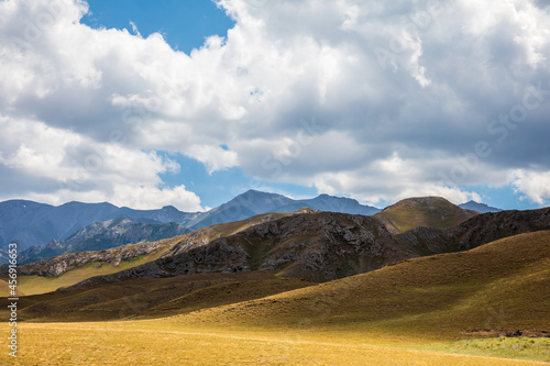 Xinjiang grassland and mountain scenery in autumn season,China.