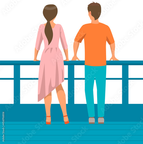 Young people in casual clothes back view. Couple man and woman on walk on embankment. Characters stand near fence looking into the distance. Pair or friends on meeting or date outdoors together