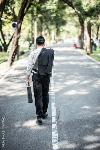 Wallpaper Mural Young businessman with a briefcase in the park Torontodigital.ca