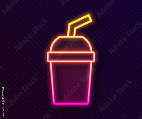 Glowing neon line Paper glass with drinking straw and water icon isolated on black background. Soda drink glass. Fresh cold beverage symbol. Vector