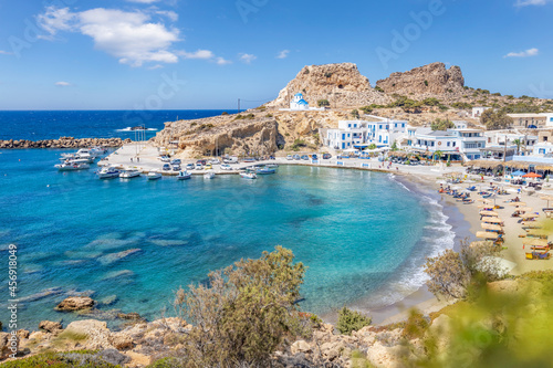 View over greek fishing village with beach, Finiki, Greek Islands
