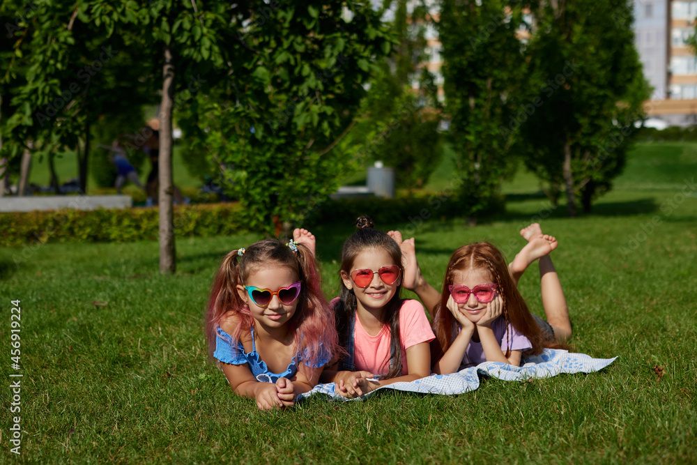 cute children girls playing together in the park cute children girls playing together in the park