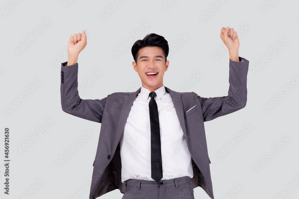 Portrait businessman in suit standing with win success isolated on white background, young asian business man is manager or executive having confident and excited is positive, expression and emotion. Portrait businessman in suit standing with win success isolated on white background, young asian business man is manager or executive having confident and excited is positive, expression and emotion.