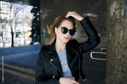woman in leather jacket outdoors walk fresh air fashion