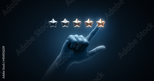Hand pointing review rating gold star sign or best excellent satisfaction five rate quality ranking success symbol on vote service rank background with like button and positive customer experience.