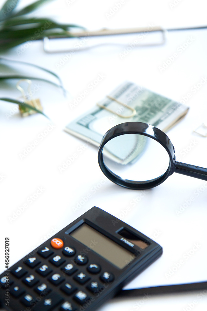 Calculator, paper money on white background. Family budget concept and investing. Close up Calculator, paper money on white background. Family budget concept and investing. Close up