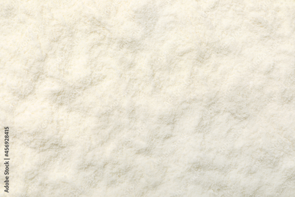 Closeup view of powdered infant formula as background. Baby milk