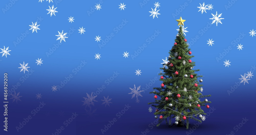 Digital image of snowflakes falling over christmas tree against blue background
