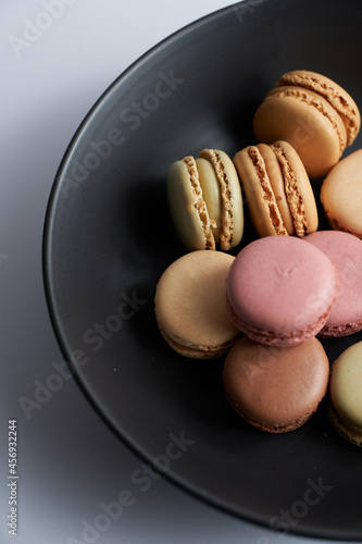 a bunch of macarons in a plate
