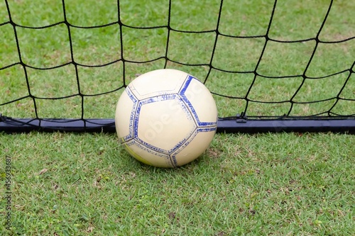 Close - up soccer ball inside soccer goal © torsakarin