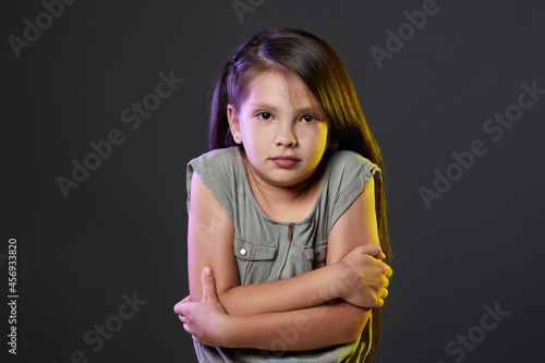 Εκτύπωση καμβά Unhappy little child girl feel cold on dark background