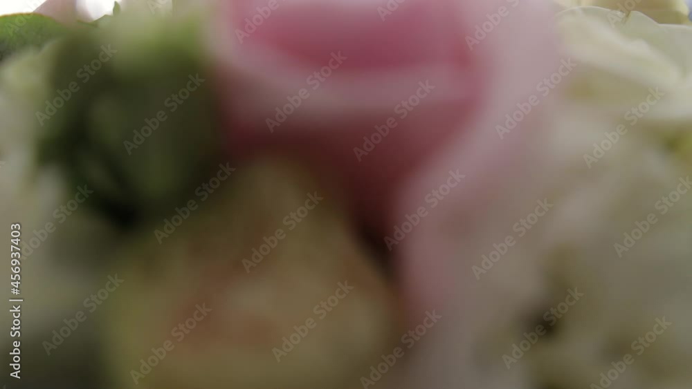 the bride and groom hold a wedding bouquet, dolly zoom camera and soft focus the bride and groom hold a wedding bouquet, dolly zoom camera and soft focus