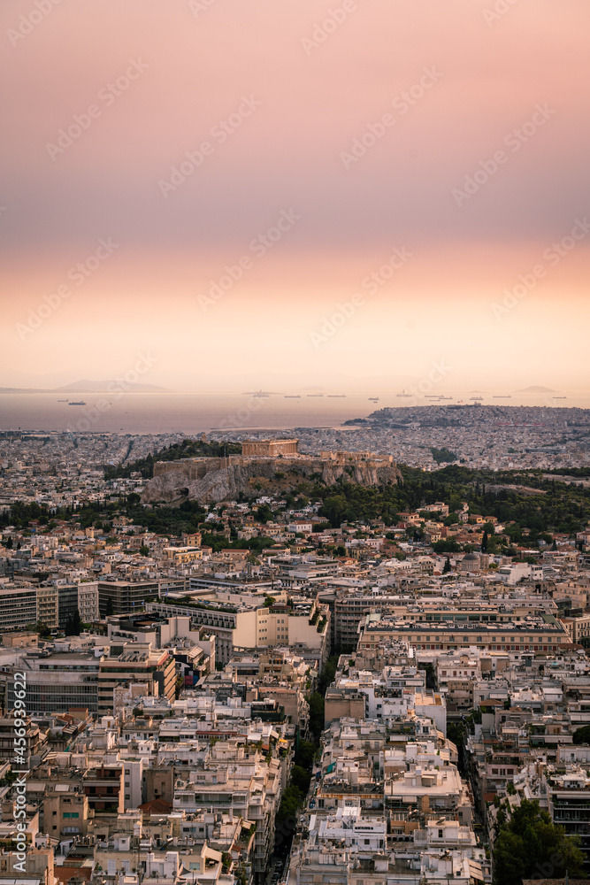 High angle view of Acropolis and Athens city in Greece at sunset from the Lycabettus Hill High angle view of Acropolis and Athens city in Greece at sunset from the Lycabettus Hill