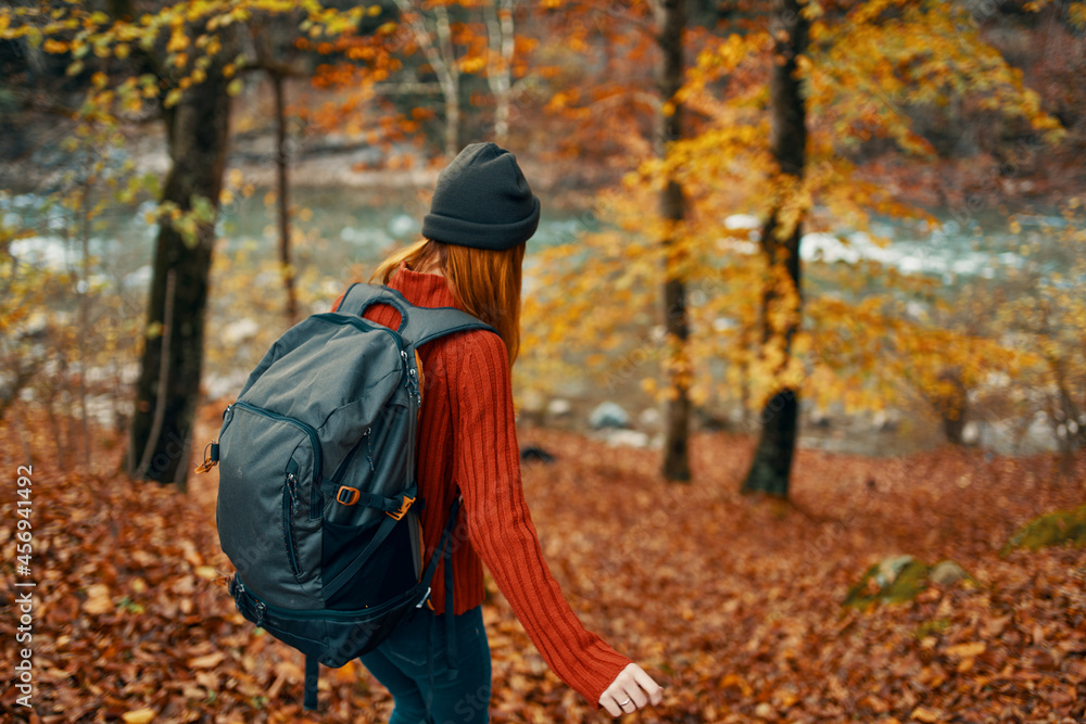 woman hiker walking in the autumn forest travel fresh air woman hiker walking in the autumn forest travel fresh air