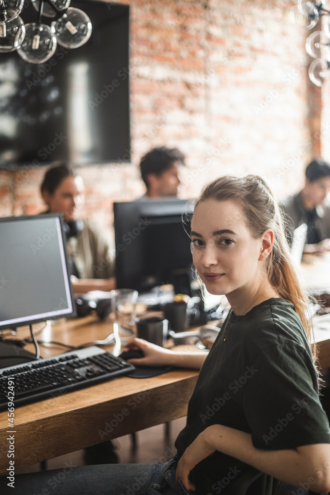 Portrait of female computer programmer at office Portrait of female computer programmer at office