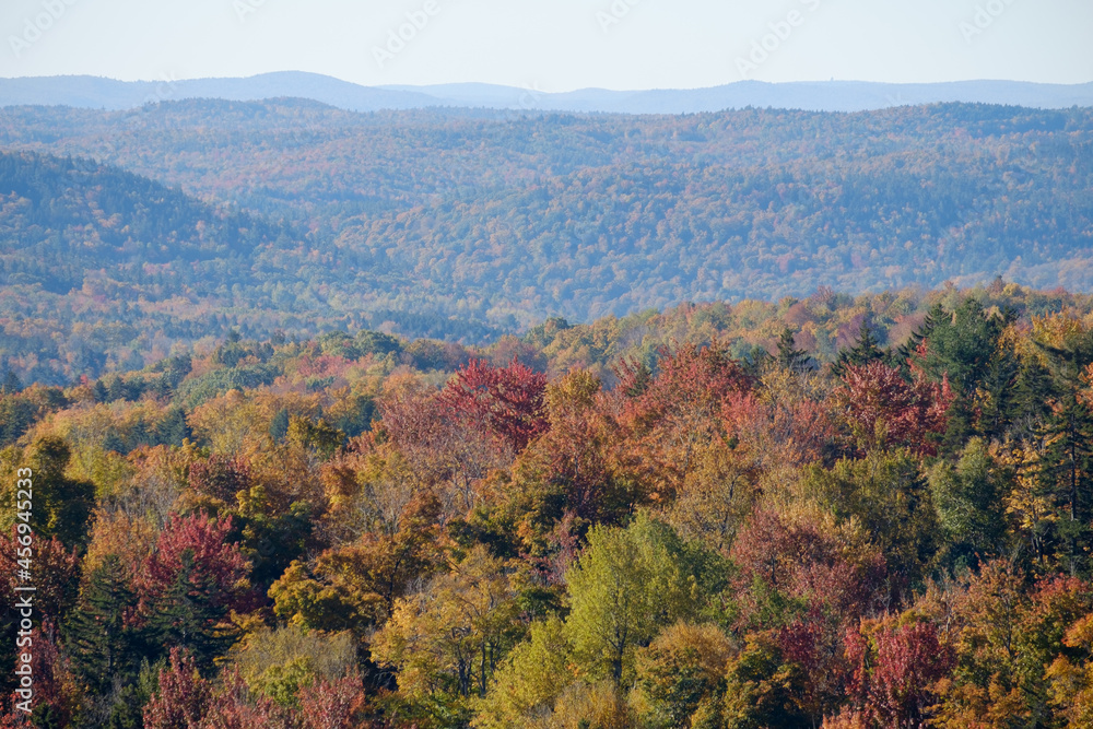 Vermont mountains covered in beautiful autumn colors on a perfect morning