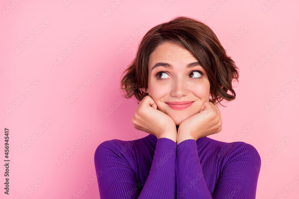 Photo of nice brunette millennial lady look empty space wear violet jumper isolated on pink color background Photo of nice brunette millennial lady look empty space wear violet jumper isolated on pink color background