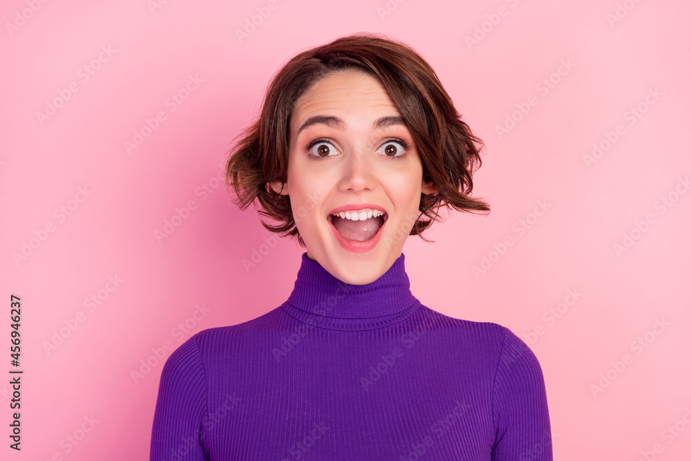 Photo of impressed brunette millennial open mouth lady wear violet sweater isolated on pink color background Photo of impressed brunette millennial open mouth lady wear violet sweater isolated on pink color background
